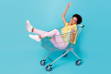 Full body profile side photo of young cheerful african girl good mood show fingers peace v-symbol...