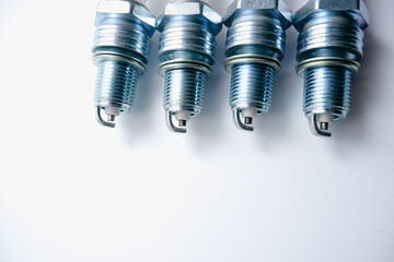 Auto parts. Car spark plugs. Spark plugs of a gasoline internal combustion engine. Space for text