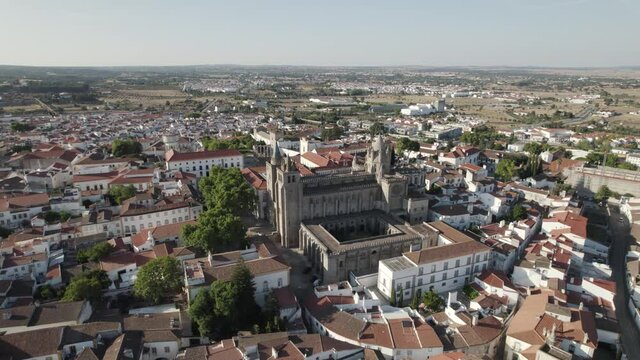 Aerial half orbit over Beautiful old cathedral in City centre, Évora - Alentejo