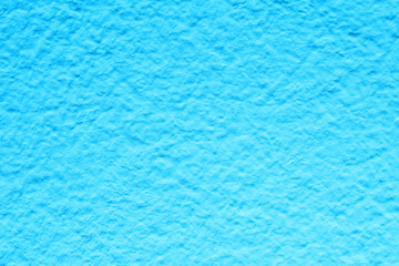 Blue wall background. Vibrant color cement texture. Plaster wall pattern. Ocean water color backdrop for graphic design.