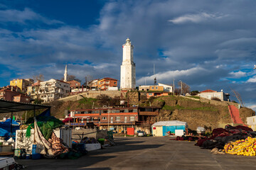 Light house at Rumelifeneri marina in Istanbul. Blue sky and natural white clouds.