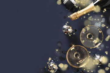 New Year festive champagne, wine glasses on blue navy background with copy space. View from above,
