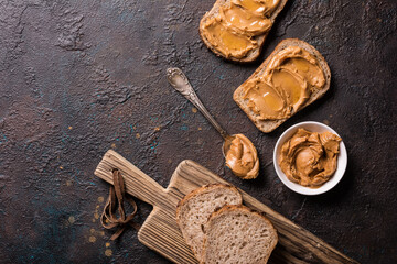 Tasty sandwiches with peanut paste and honey for breakfast