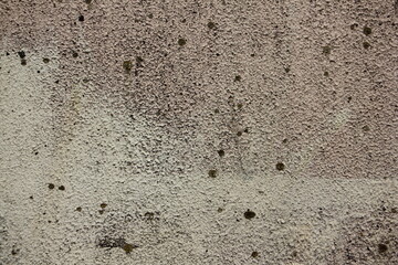 Rough gray dry plastered concrete wall with spots surface close up industrial background texture