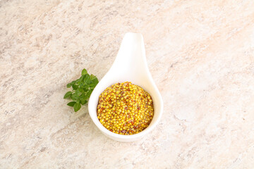 Grain mustard sauce in the bowl