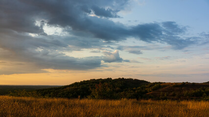 Clouds and hills in the evening, countryside.
