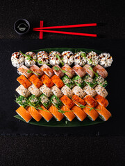 tasty sushi on the black background