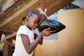 Girl in Africa drink clean water
