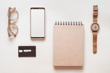 Online shopping smartphone and credit card flat lay beige background