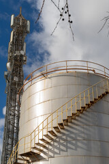 Industrial metal fuel tanks on a sunny day