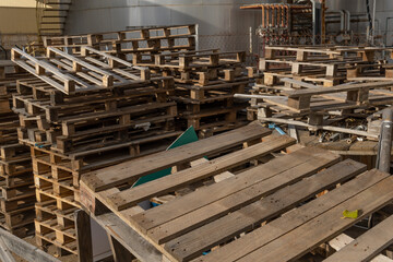 Wooden pallets irregularly stacked on