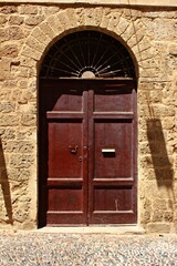 Fototapeta na wymiar Italy, Tuscany: Old Wooden Doorway.