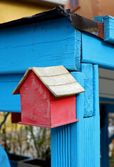 miniature toy wooden house in the garden