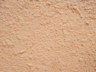 Pastel Elegance: Cement Stucco Wall in Soft Pink Hue
