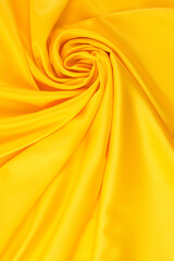 draped yellow silk fabric of satin weave, texture, background