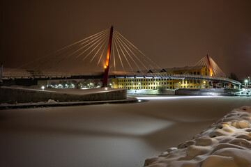 Colorful ship with festive lights frozen in river at Christmas time. Restaurant on water at winter....