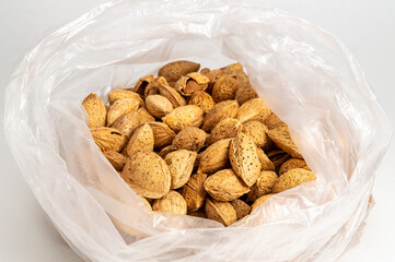 inshell almonds in a disposable plastic bag