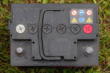 Pb lead car batteries on a grass in the nature