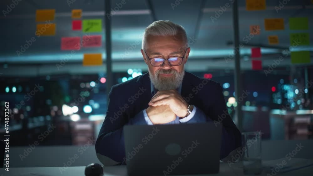 Aufkleber portrait of a senior experienced businessman talking with clients on video call in modern office at 