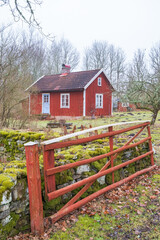Red little cottage in the countryside