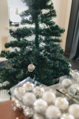 Box with bright glass Christmas balls close-up.