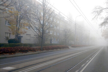 Big heavy fog in the city. Foggy autumn morning in the city. Danger when driving.