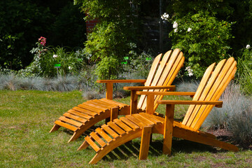 Wooden loungers in the park for relaxation. Full relax. Useful relaxation in the garden.