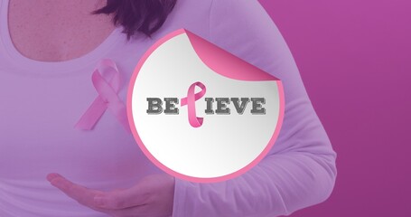 Composition of woman with breast cancer awareness ribbon and believe text against pink background