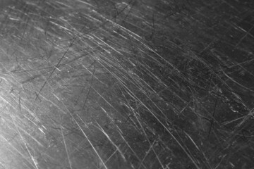 Texture of scratched metallic surface as background, closeup