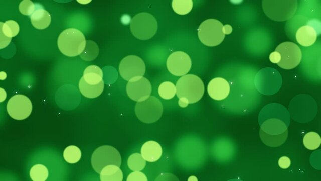 Animation of colorful circles, bokeh effect. Abstract floating particles, lights. Dark green background. Looped live wallpaper. Festive animated stock footage. Holiday, christmas, new year.