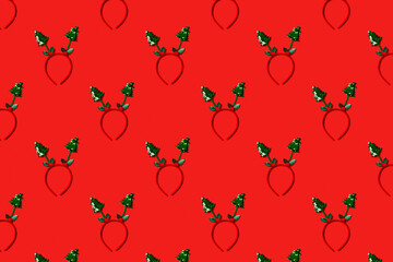 Funny christmas tree headband on red background. Festive minimal