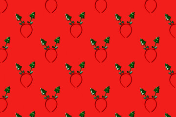 Funny christmas tree headband on red background. Festive minimal