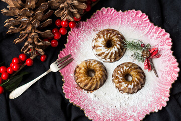 Still life of cakes on a pink plate.