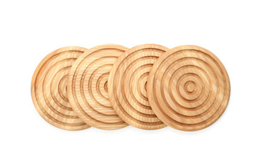 Wooden cup coasters on white background, top view