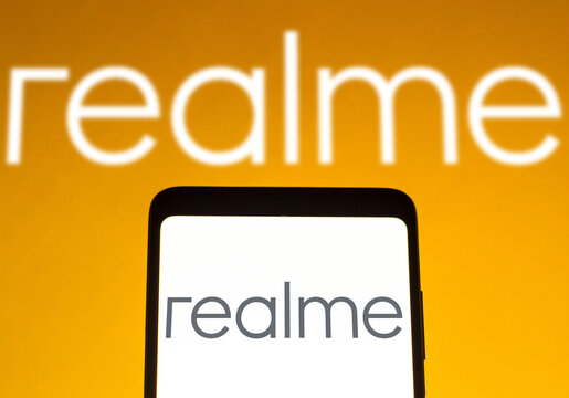 December 14, 2021, Brazil. In this photo illustration the Realme logo seen displayed on a smartphone and on the background.