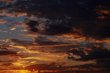 Gorgeous scenic of the sunrise or sunset with dark lining and cloud on the orange sky. Vibrant and Colorful background