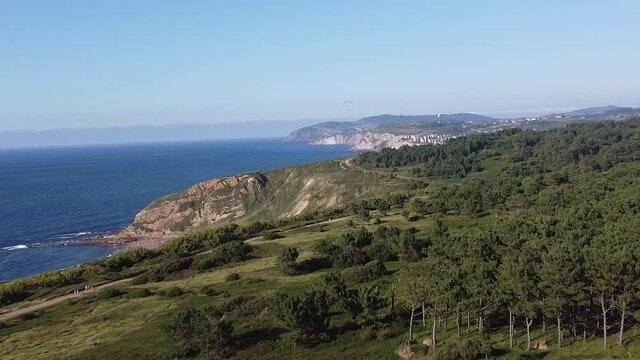 aerial footage of cliffs in the sea, in the coast of the basque country
