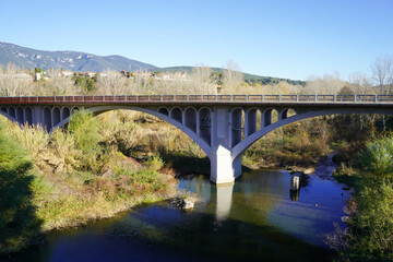 Fototapeta na wymiar bridge over the river in the mountains