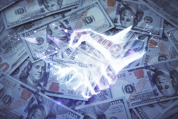 Double exposure of handshake drawing over usa dollars bill background. Partnership concept.