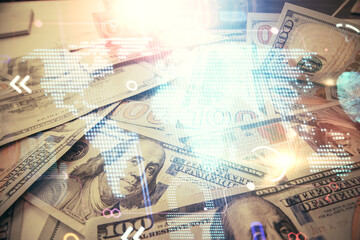Double exposure of world map drawing over us dollars bill background. International concept.