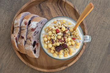Breakfast with cereal in milk and bread.