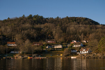 Fototapeta na wymiar Landscape of hilly area of island in Lusefjord. Beautiful nature on sunny day.