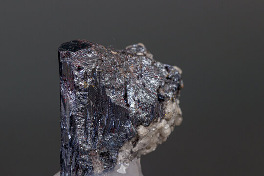 macro mineral Acanthite stone on a black background