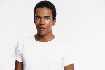 Young black man dressed white t-shirt posing and looking at camera