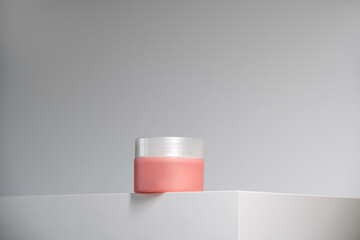 pink cream pot on white background