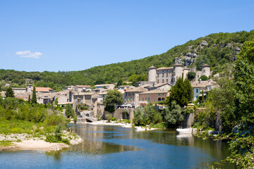 Fototapeta na wymiar The town of Vogue in the middle of the Ardeche gorges in Europe, France, Ardeche, in summer, on a sunny day.