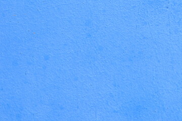 Blue wall close-up useful as background. Colorful concrete wall, in blue tone, at Paraty, Brazil.