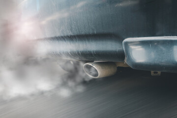 air pollution of environment from diesel vehicle exhaust pipe on road