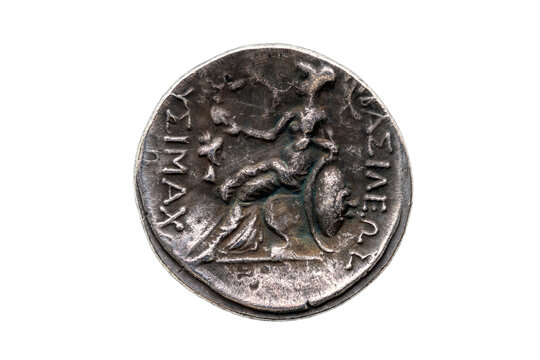Reverse side of a Greek silver Drachum coin replica of  Alexander the Great dated from 336-323 BC cut out and isolated on a white background, stock photo image