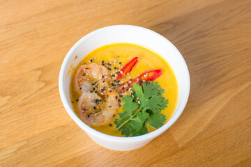 Asian soup, street food, pumpkin with shrimp